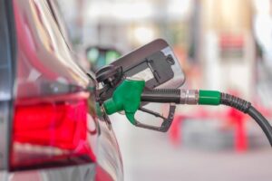 gas pump filling up car with quality gas